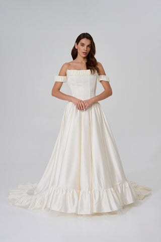 Wedding set with corset and skirt made of dark ivory satin with dropped sleeves, lacing at the back, gathering at the bottom, and a train