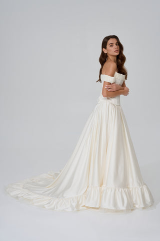 Wedding set with corset and skirt made of dark ivory satin with dropped sleeves, lacing at the back, gathering at the bottom, and a train - designer piece by Caribis