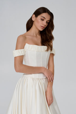 Wedding set with corset and skirt made of dark ivory satin with dropped sleeves, lacing at the back, gathering at the bottom, and a train