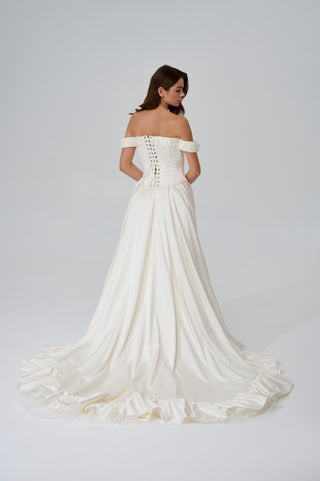 Wedding set with corset and skirt made of dark ivory satin with dropped sleeves, lacing at the back, gathering at the bottom, and a train