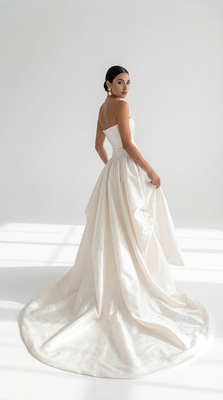 Luxurious taffeta dress with a dropped bodice and voluminous skirt with a dramatic train - designer piece by Caribis