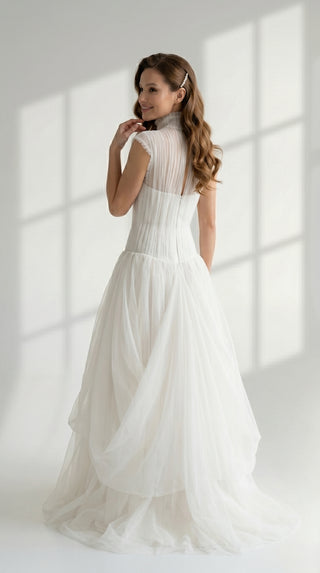 Laconic dress made of natural chiffon with a high neck and a flowing silhouette