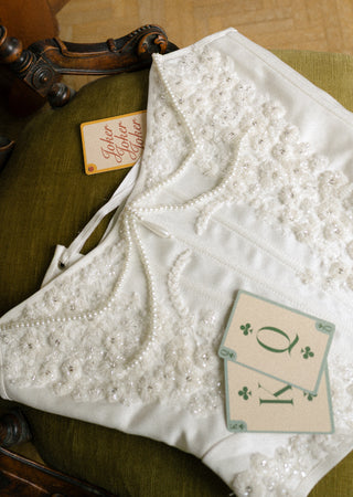Ivory hand-embroidered bridal corset and skirt — customer wedding photograph