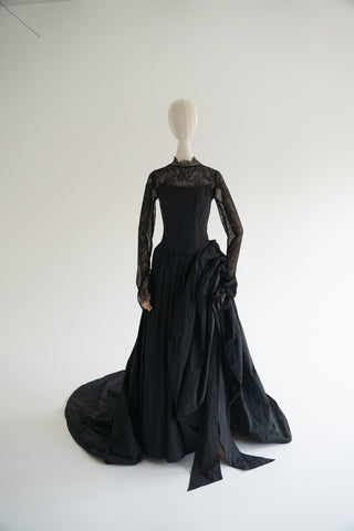 Sculptural taffeta gown with delicate lace detailing and dramatic train