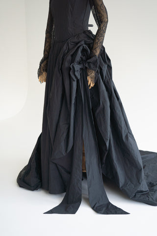 Sculptural taffeta gown with delicate lace detailing and dramatic train