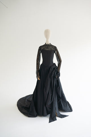 Sculptural taffeta gown with delicate lace detailing and dramatic train