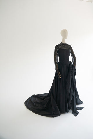 Sculptural taffeta gown with delicate lace detailing and dramatic train