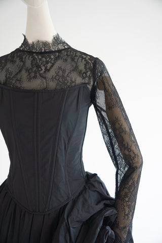 Sculptural taffeta gown with delicate lace detailing and dramatic train - designer piece by Caribis