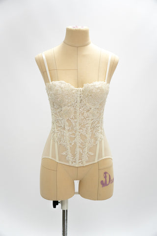 Exquisite corset with luxurious voluminous embroidery and a delicate transparent base