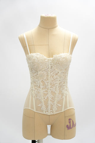 Exquisite corset with luxurious voluminous embroidery and a delicate transparent base