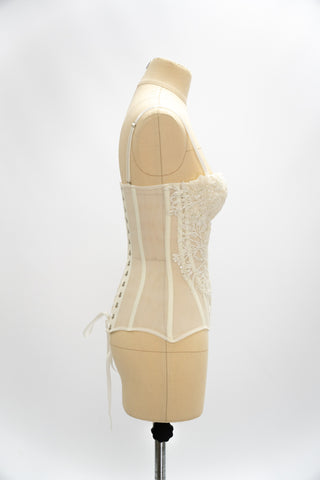Exquisite corset with luxurious voluminous embroidery and a delicate transparent base