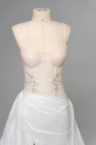 Delicate transparent corset with bird embroidery and textured skirt with train