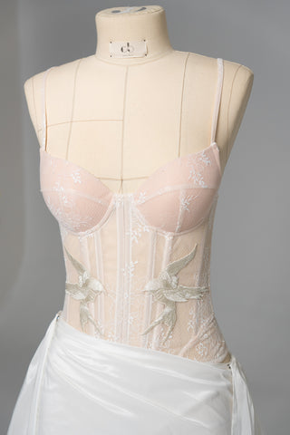 Delicate transparent corset with bird embroidery and textured skirt with train