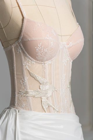 Delicate transparent corset with bird embroidery and textured skirt with train