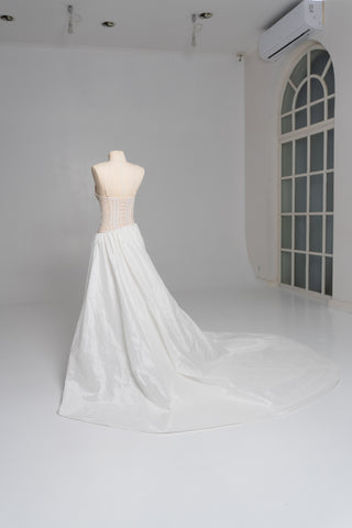 Delicate transparent corset with bird embroidery and textured skirt with train