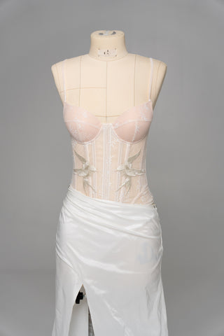 Delicate transparent corset with bird embroidery and textured skirt with train