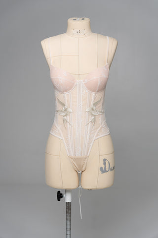 Delicate transparent corset with bird embroidery and textured skirt with train