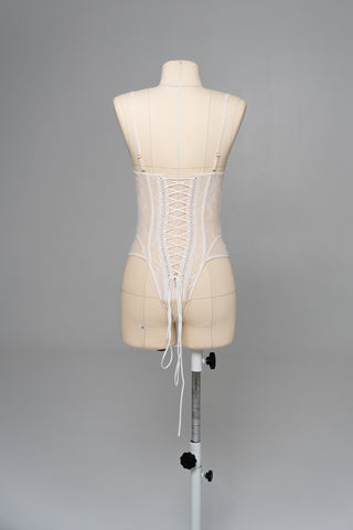 Delicate transparent corset with bird embroidery and textured skirt with train