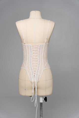 Delicate transparent corset with bird embroidery and textured skirt with train