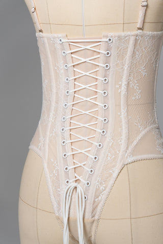 Delicate transparent corset with bird embroidery and textured skirt with train