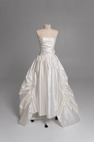Luxurious taffeta dress with a dropped bodice and voluminous skirt with a dramatic train