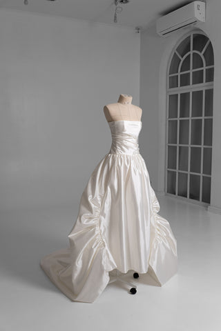 Luxurious taffeta dress with a dropped bodice and voluminous skirt with a dramatic train