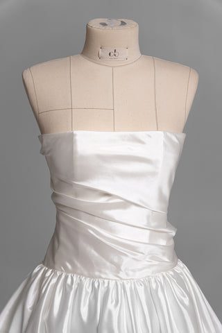 Luxurious taffeta dress with a dropped bodice and voluminous skirt with a dramatic train