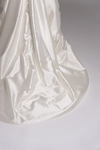 Luxurious taffeta dress with a dropped bodice and voluminous skirt with a dramatic train