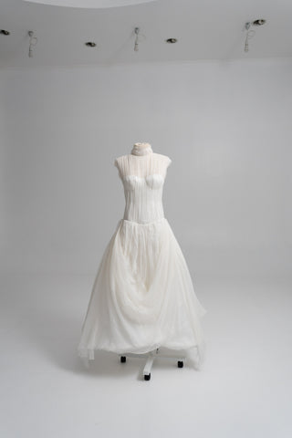 Laconic dress made of natural chiffon with a high neck and a flowing silhouette