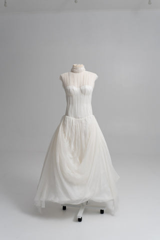 Laconic dress made of natural chiffon with a high neck and a flowing silhouette