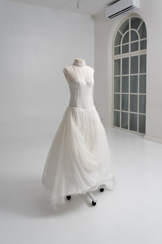 Laconic dress made of natural chiffon with a high neck and a flowing silhouette