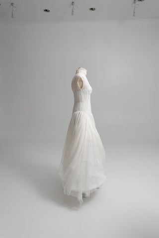 Laconic dress made of natural chiffon with a high neck and a flowing silhouette
