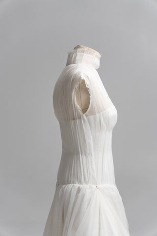 Laconic dress made of natural chiffon with a high neck and a flowing silhouette