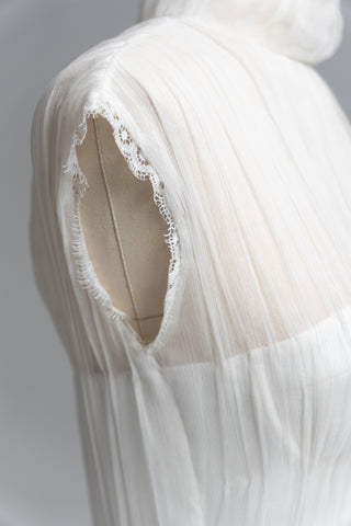 Laconic dress made of natural chiffon with a high neck and a flowing silhouette
