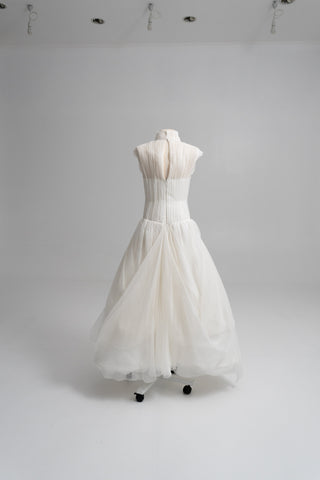 Laconic dress made of natural chiffon with a high neck and a flowing silhouette