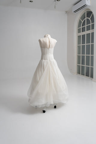 Laconic dress made of natural chiffon with a high neck and a flowing silhouette