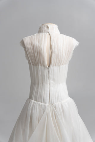 Laconic dress made of natural chiffon with a high neck and a flowing silhouette