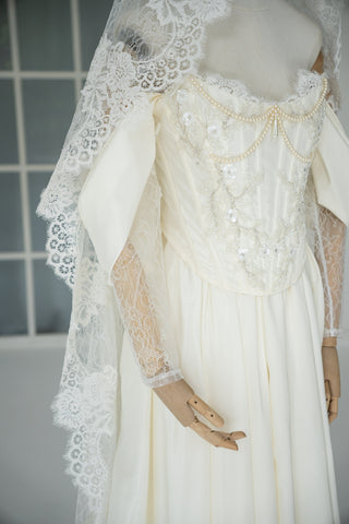 Wedding dress-transformer with separate corset — fluffy skirt with pleats, lace sleeves, and pearl embroidery