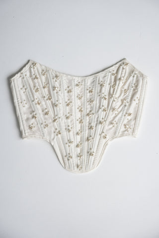 Handmade beaded corset with a long, fluffy skirt with a slit