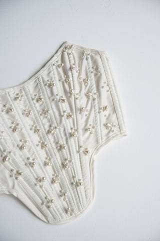 Handmade beaded corset with a long, fluffy skirt with a slit