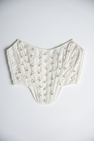 Handmade beaded corset with a long, fluffy skirt with a slit