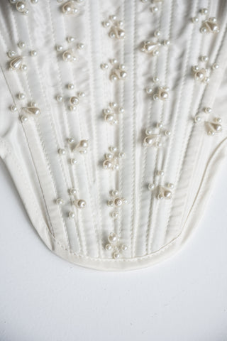 Handmade beaded corset with a long, fluffy skirt with a slit