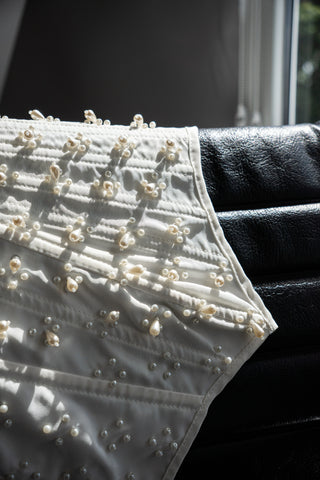 Handmade beaded corset with a long, fluffy skirt with a slit