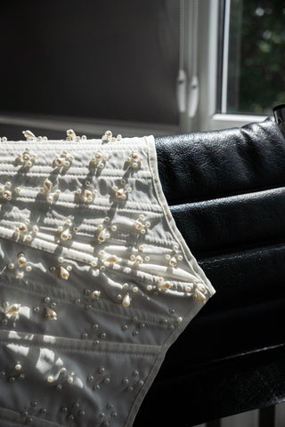 Handmade beaded corset with a long, fluffy skirt with a slit