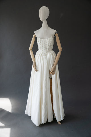 Handmade beaded corset with a long, fluffy skirt with a slit