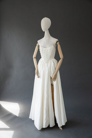 Handmade beaded corset with a long, fluffy skirt with a slit