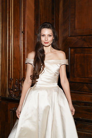 Tanya Bohdan x Caribis off-the-shoulder wedding dress - silky material, lacing on the back, and a long train - designer piece by Caribis