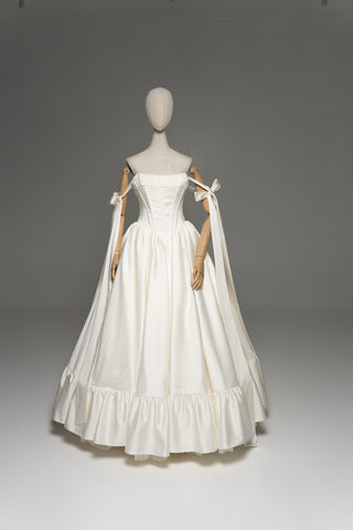 Wedding dress with a corset bodice, dropped straps, and a full skirt