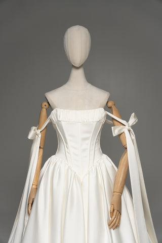 Wedding dress with a corset bodice, dropped straps, and a full skirt - designer piece by Caribis