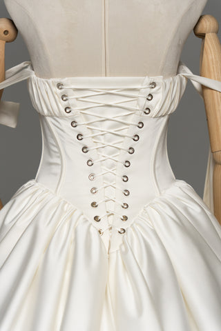 Wedding dress with a corset bodice, dropped straps, and a full skirt